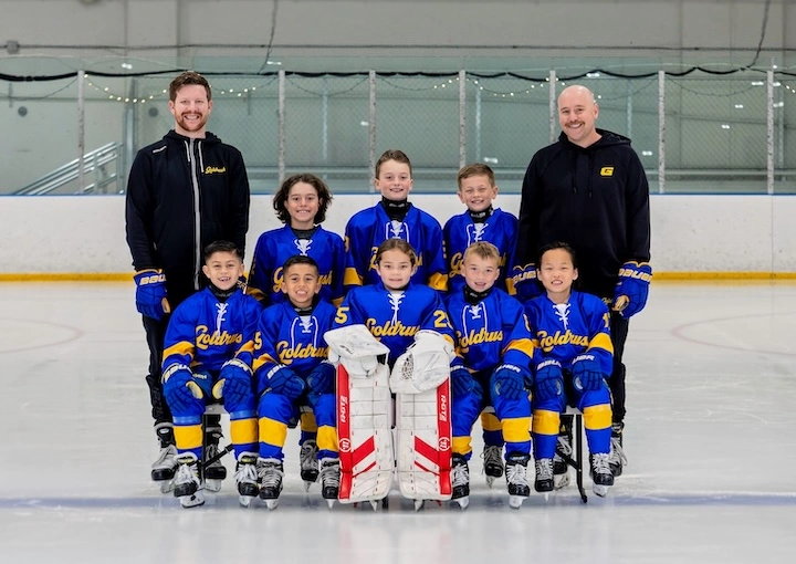 Goldrush 8U team photo on the ice at Lake Forest Ice Palace